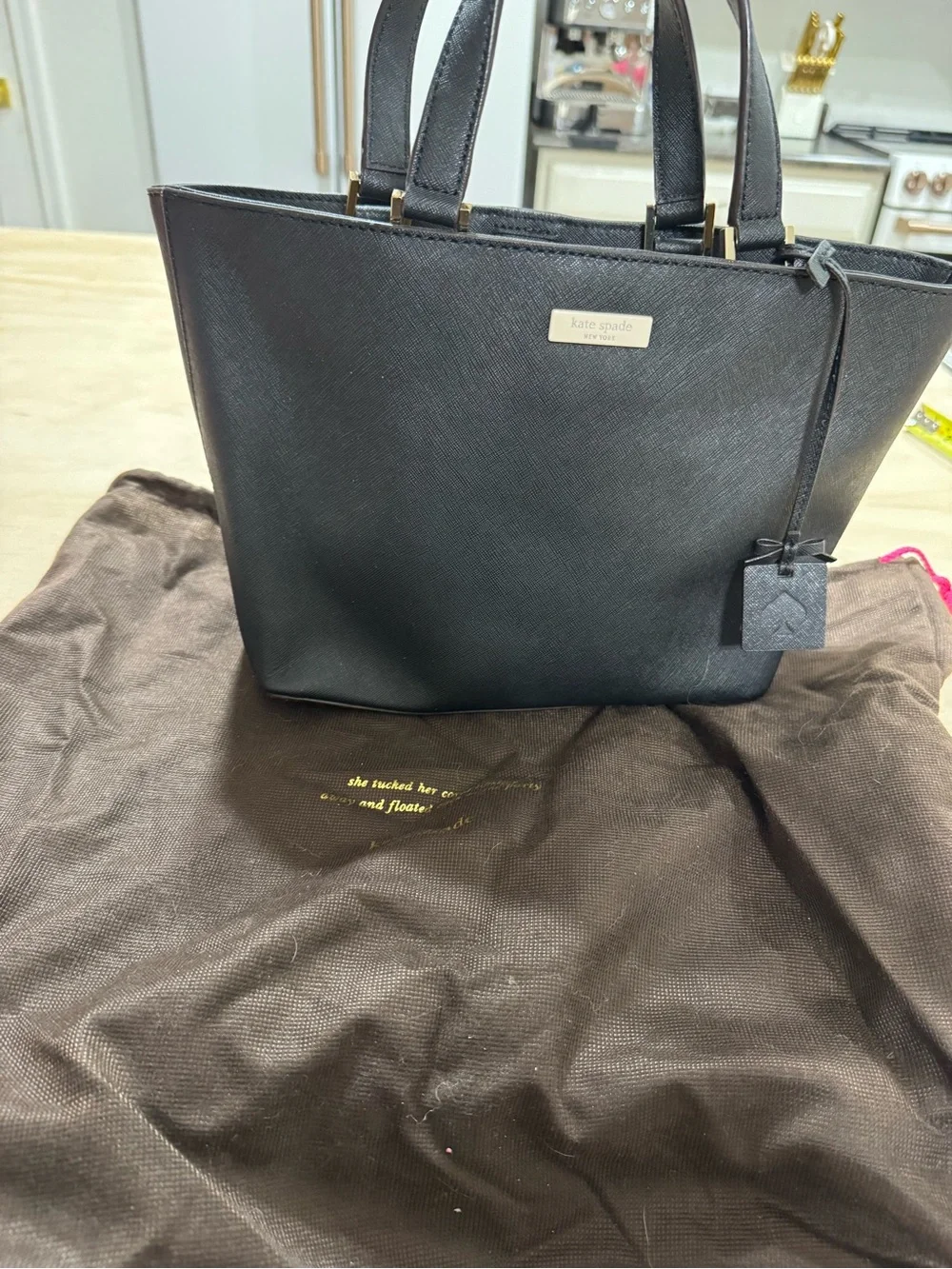 kate spade black saffiano tote with gold accents
